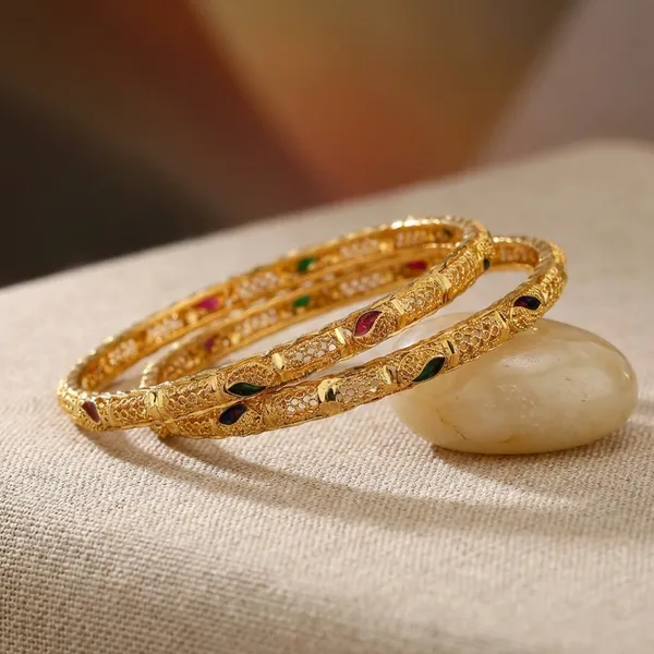 Gold_Tone_Engraved_Bangles_With_Red_And_Black_Stone_Embellishments_Set_Of_2