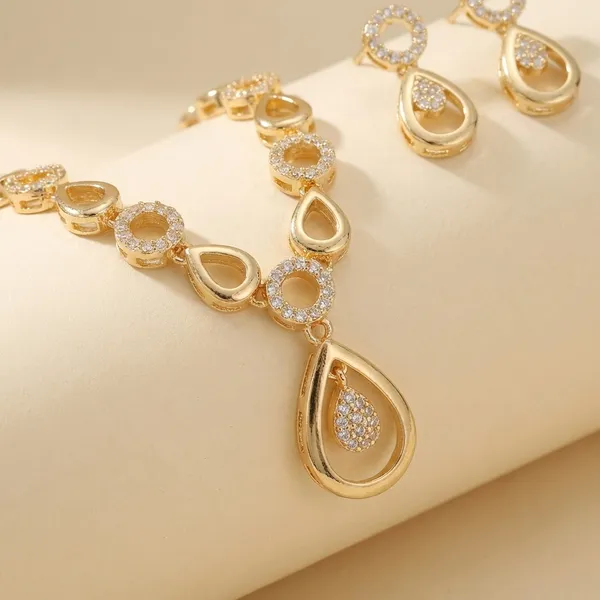 Gold_Tone_Teardrop_And_Circle_Necklace_Set_With_Earrings_Nk_9