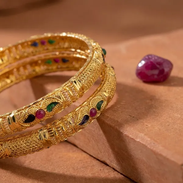 Gold_Tone_Textured_Bangles_With_Ruby_And_Emerald_Accents_Set_Of_2