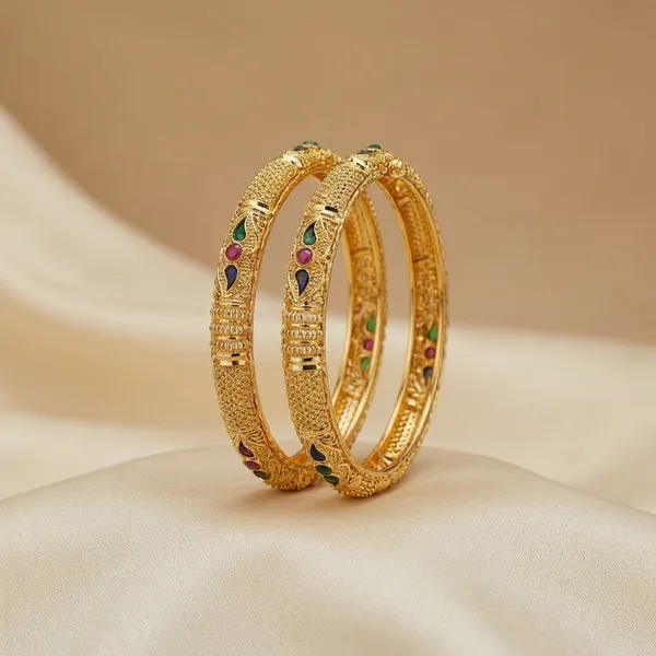 Gold_Tone_Textured_Bangles_With_Ruby_And_Emerald_Accents_Set_Of_2