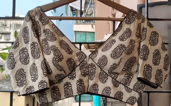 Beige_And_Black_Printed_Blouse_With_Flared_Sleeves