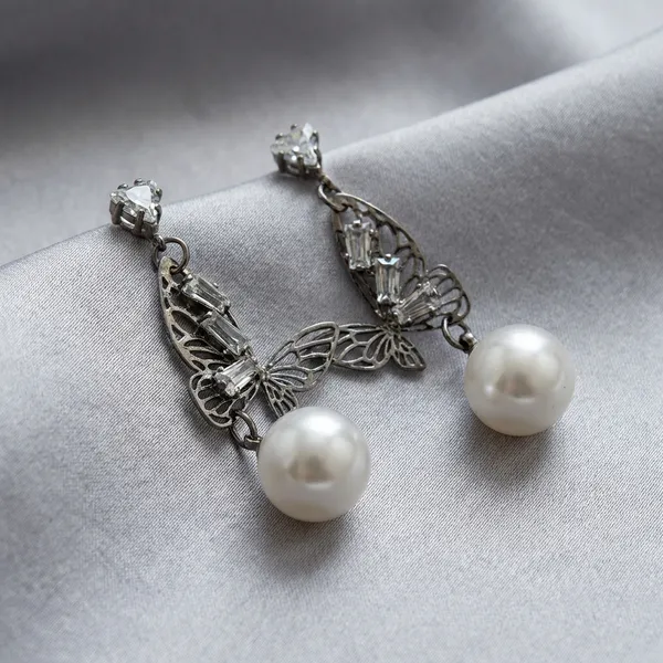 Silver_And_White_Butterfly_Dangle_Earrings_With_Heart_Pearl_Accents_And_Crystal_Studs