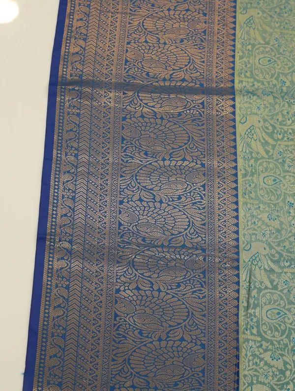 Parrot_Green_Kanchipuram_Inspired_Semi_Silk_Saree_With_Wide_Contrast_Border