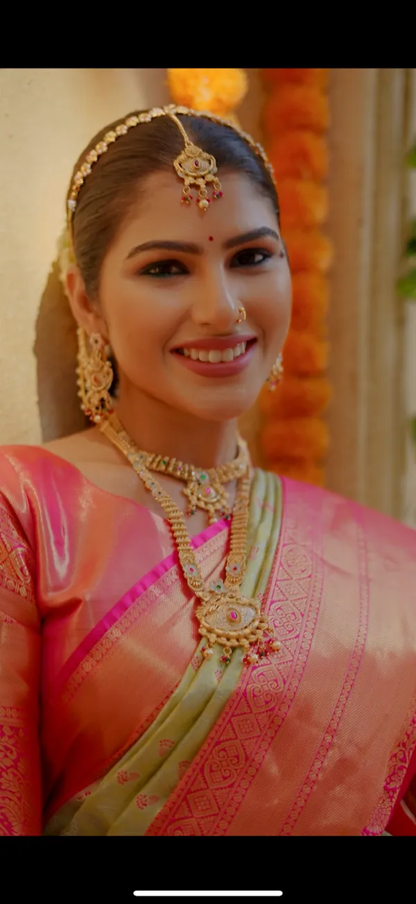 Pistachio_Pastel_Green_&_Coral_Pink_Kanchipuram_Inspired_Semi_Silk_Saree_With_Geometric_Zari_Border