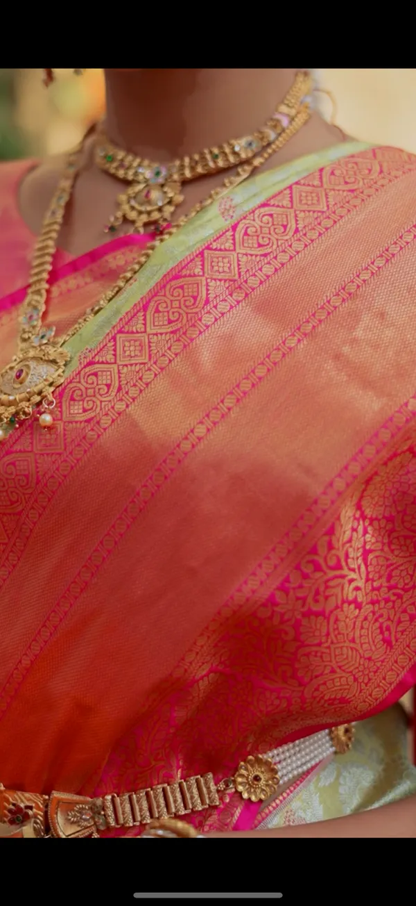 Pistachio_Pastel_Green_&_Coral_Pink_Kanchipuram_Inspired_Semi_Silk_Saree_With_Geometric_Zari_Border