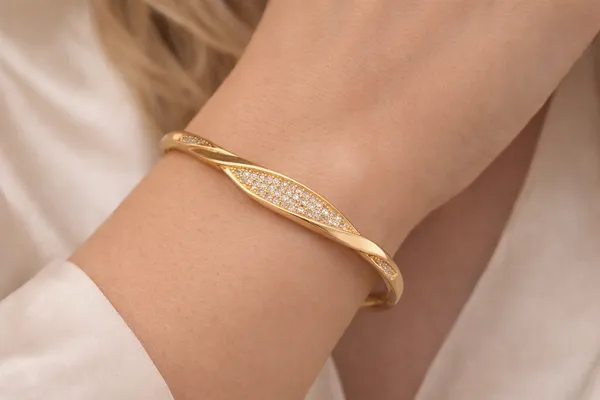 Golden_Twisted_Bangle_With_Crystal_Embellishments_For_Women