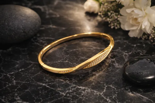 Golden_Twisted_Bangle_With_Crystal_Embellishments_For_Women