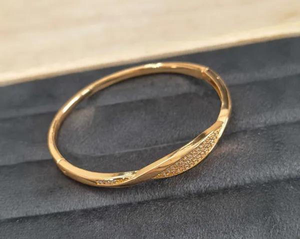 Golden_Twisted_Bangle_With_Crystal_Embellishments_For_Women