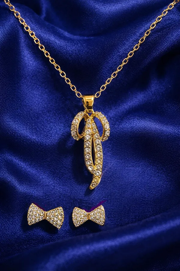 Gold_Plated_Crystal_Studded_Pendant_Necklace_With_Bow_Earrings_Jewellery_Set_For_Women