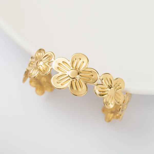 Golden_Floral_Cuff_Bracelet_With_Dimensional_Flower_Design_For_Women