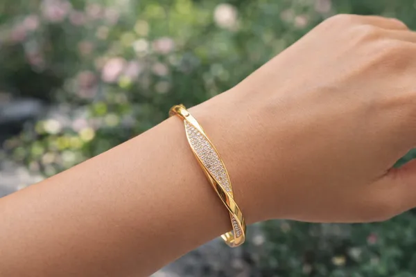 Golden_Twisted_Bangle_With_Crystal_Embellishments_For_Women