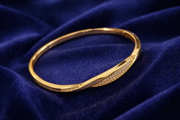 Golden_Twisted_Bangle_With_Crystal_Embellishments_For_Women