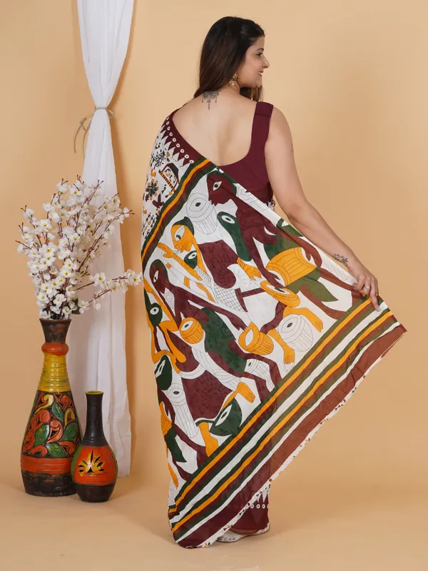Elegant_Tribal_Art_Printed_Cotton_Saree_–_Maroon_Border_Designer_Saree