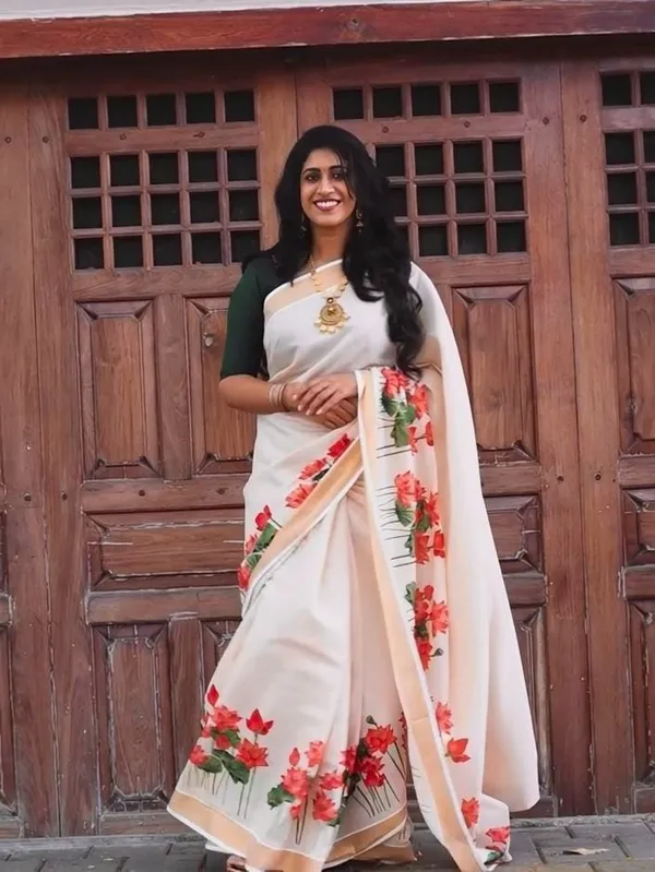 Elegant_Chiku_Linen_Kerala_Saree_With_Digital_Floral_Print_&_Gold_Jari_Border