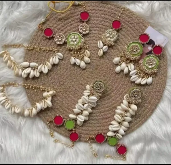 Handcrafted_Bohemian_Cowrie_Shell_Jewelry_Set_With_Colorful_Pom_Poms