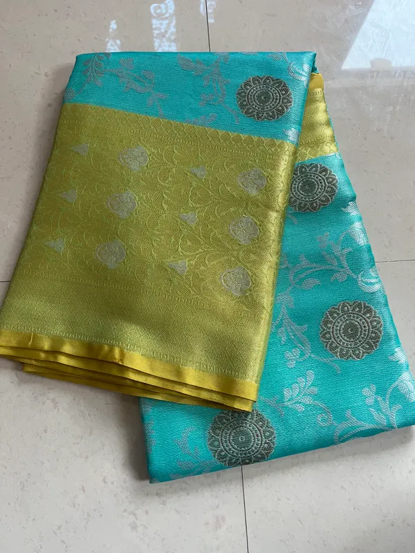 Turquoise_And_Golden_Yellow_Banarasi_Silk_Saree_With_Silver_Butta_Motifs