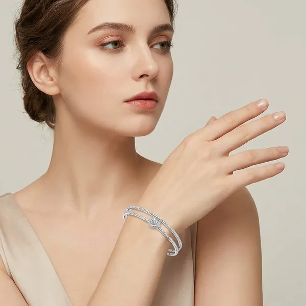 Multi_Layer_Crystal_Studded_Silver_Toned_Bangle_Bracelet_With_Infinity_Knot_Design_For_Women