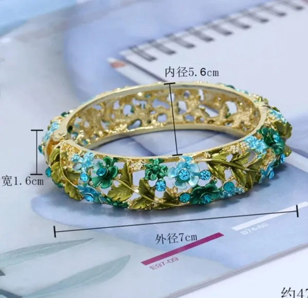Elegant_Gold_Tone_Floral_Bangle_With_Blue_And_Green_Gemstone_Accents_For_Women