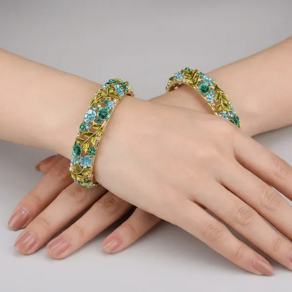 Elegant_Gold_Tone_Floral_Bangle_With_Blue_And_Green_Gemstone_Accents_For_Women