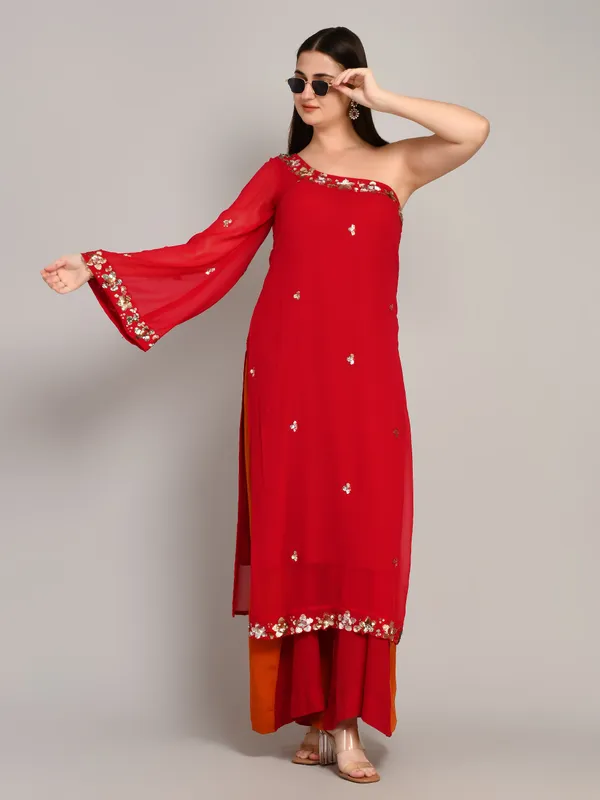 Hot_pink_and_rust_one_shoulder_kurti_with_flared_plazo_