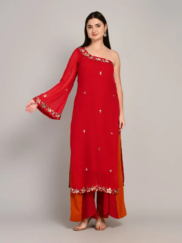 Hot_pink_and_rust_one_shoulder_kurti_with_flared_plazo_