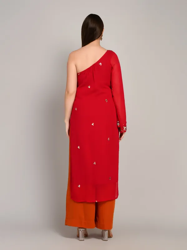 Hot_pink_and_rust_one_shoulder_kurti_with_flared_plazo_