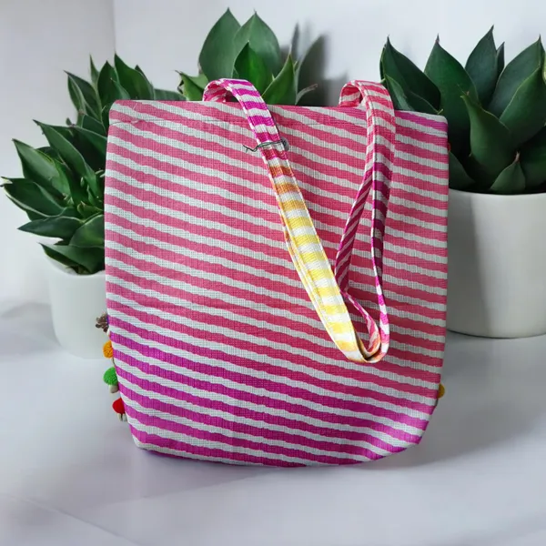 Pink_Large_Size_Pom_Pom_Lace_Bag_In_Pink_Leheriya_Silk_For_Women
