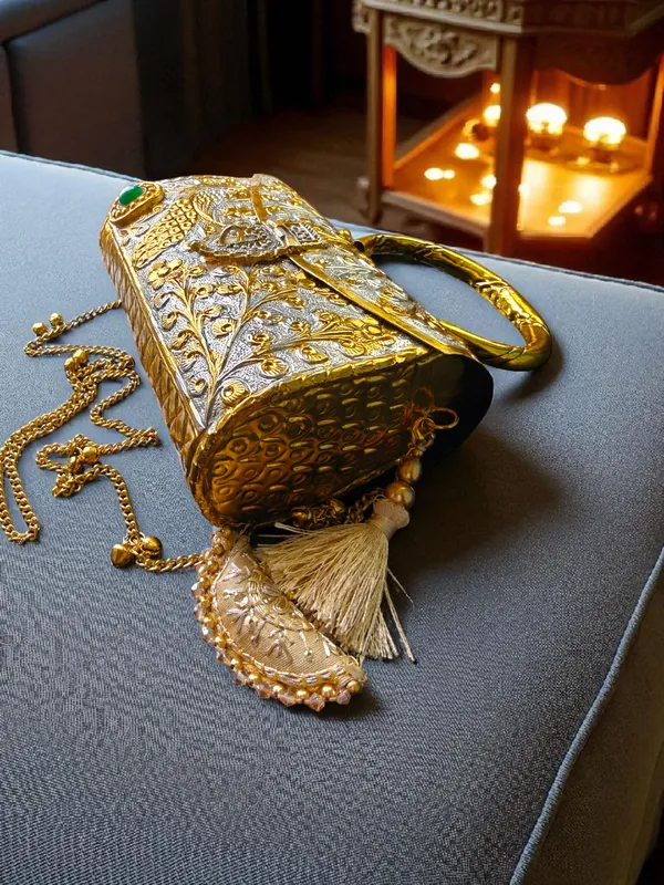 Gold_Peacock_Engraved_Dual_Tone_Brass_Bag_With_Tassels_For_Women