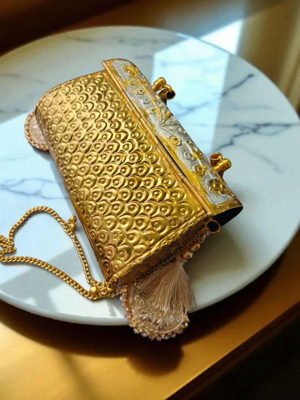 Gold_Peacock_Engraved_Dual_Tone_Brass_Bag_With_Tassels_For_Women