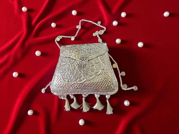 Silver_Ornate_Silver_Tassels_Bag_With_Coins_And_Ghungroo_Latkans_For_Women