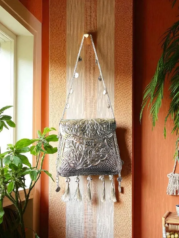 Silver_Ornate_Silver_Tassels_Bag_With_Coins_And_Ghungroo_Latkans_For_Women