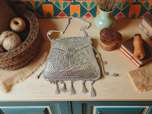 Silver_Ornate_Silver_Tassels_Bag_With_Coins_And_Ghungroo_Latkans_For_Women