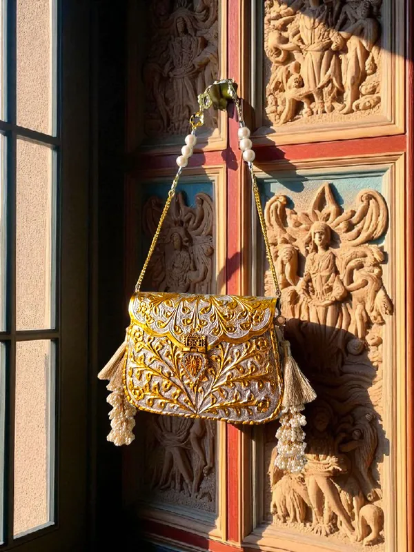 Gold_Dual_Tone_Rectangular_Gold_Silver_Floral_Engraved_Brass_Handbag_With_Side_Tassels_For_Women