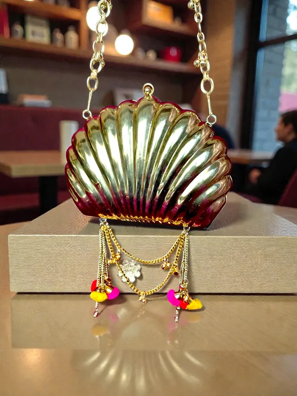 Gold_The_Shell_Heritage_Brass_Ghungroo_Bag_In_Gold_Tone_For_Women