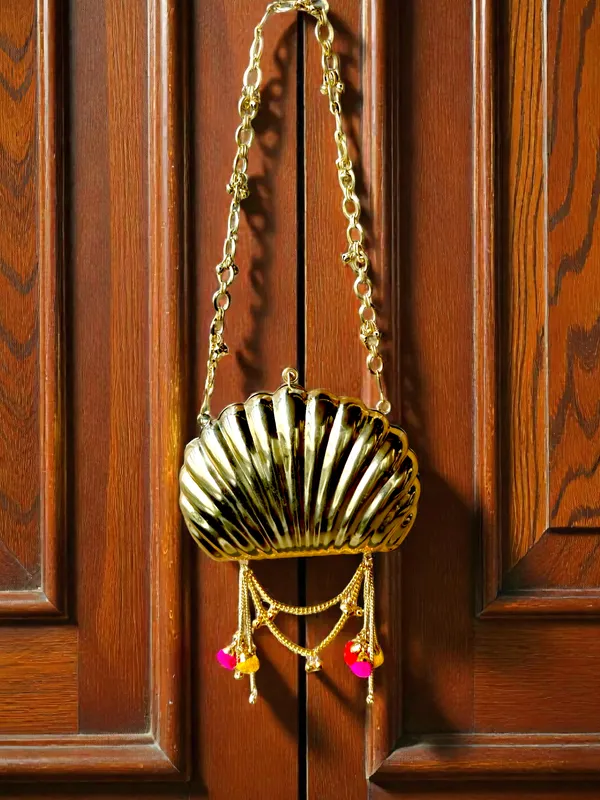 Gold_The_Shell_Heritage_Brass_Ghungroo_Bag_In_Gold_Tone_For_Women