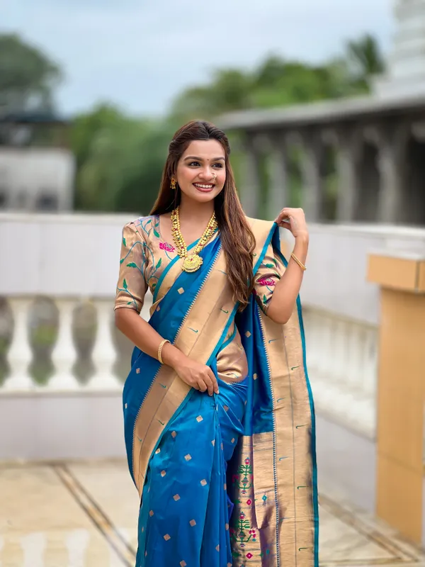 Firozi_Soft_Pethani_Silk_Saree_With_Zari_Weaving_Motifs_Design_And_Meenakari_Weaving_Rich_Pallu_With_Meenakari_Weaving_Double_Munia_Border_And_Tassels_Attached_At_Pallu_End_Blouse_For_Women
