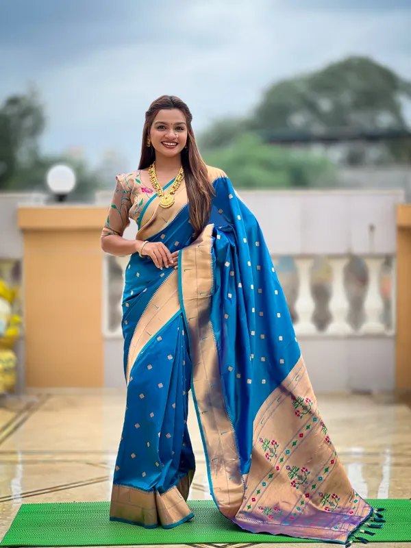 Firozi_Soft_Pethani_Silk_Saree_With_Zari_Weaving_Motifs_Design_And_Meenakari_Weaving_Rich_Pallu_With_Meenakari_Weaving_Double_Munia_Border_And_Tassels_Attached_At_Pallu_End_Blouse_For_Women