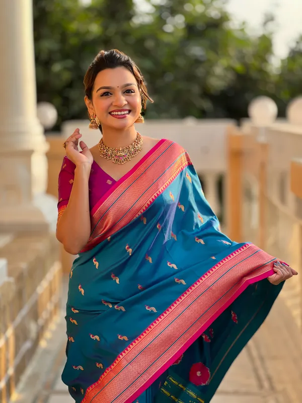 Sky_Blue_Soft_Pethani_Silk_Saree_With_Zari_Weaving_Motifs_Design_And_Meenakari_Weaving_Rich_Pallu_With_Meenakari_Weaving_Border_And_Tassels_Attached_At_Pallu_End_Blouse_For_Women