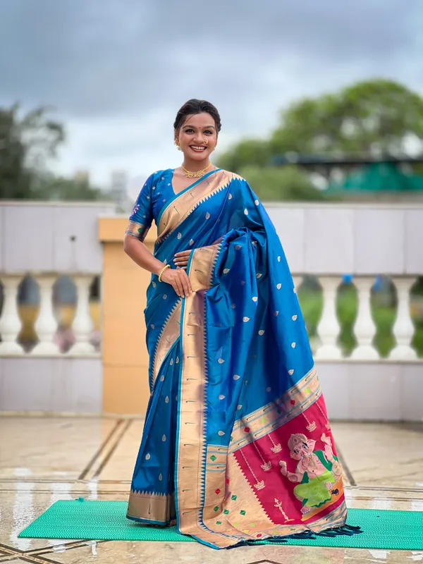 Firozi_Soft_Pethani_Silk_Saree_With_Zari_Weaving_Motifs_Design_And_Meenakari_Weaving_Rich_Pallu_With_Meenakari_Weaving_Munia_Border_And_Tassels_Attached_At_Pallu_End_Blouse_For_Women