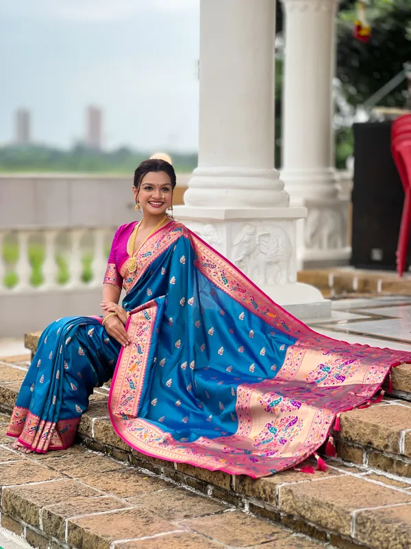 Sky_Blue_Soft_Pethani_Silk_Saree_With_Zari_Weaving_Motifs_Design_And_Meenakari_Weaving_Rich_Pallu_With_Meenakari_Weaving_Border_And_Tassels_Attached_At_Pallu_End_Blouse_For_Women