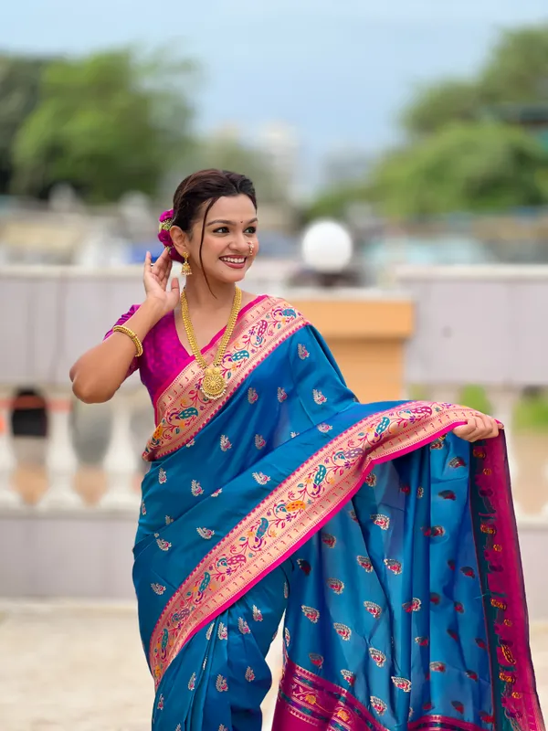 Sky_Blue_Soft_Pethani_Silk_Saree_With_Zari_Weaving_Motifs_Design_And_Meenakari_Weaving_Rich_Pallu_With_Meenakari_Weaving_Border_And_Tassels_Attached_At_Pallu_End_Blouse_For_Women