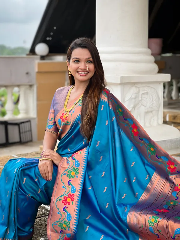 Sky_Blue_Soft_Paithani_Silk_Saree_With_Zari_Weaving_Meenakari_Motifs_Design_And_Meenakari_Weaving_Rich_Pallu_With_Meenakari_Weaving_Border_And_Tassels_Attached_At_Pallu_And_Blouse_For_Women