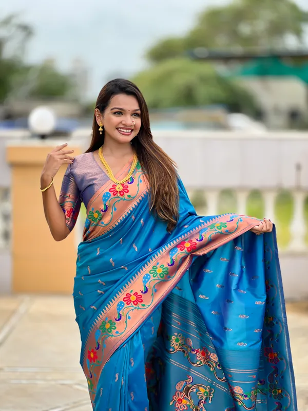 Sky_Blue_Soft_Paithani_Silk_Saree_With_Zari_Weaving_Meenakari_Motifs_Design_And_Meenakari_Weaving_Rich_Pallu_With_Meenakari_Weaving_Border_And_Tassels_Attached_At_Pallu_And_Blouse_For_Women