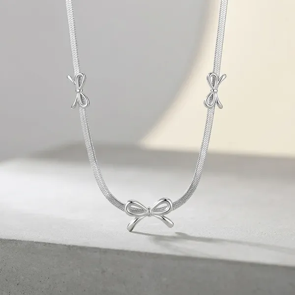 Decorative_Metal_Towel_Bar_With_Bow_Ends_-_Silver_Finish_Wall_Mount_Hanger