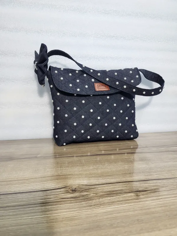 Navy_Blue_Denim_Crossbody_Bag_With_Floral_Embellishments