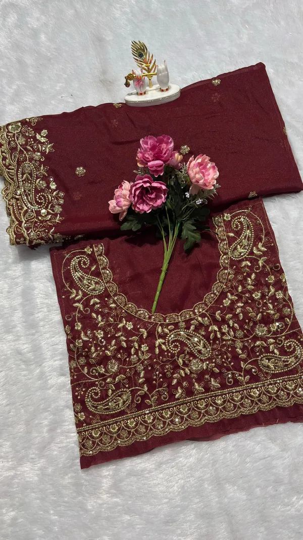 Exquisite_Maroon_Embroidered_Saree_Elevate_your_ethnic_look_with_this_stunning_maroon_saree_featuring_a_rich,_intricate_zari_border_and_delicate_floral_motifs._Crafted_from_premium_lightweight_fabric,_it_comes_with_a_heavily_embroidered_designer_blouse_piece_for_a_complete_royal_look._Perfect_for_weddings_and_festive_occasions.