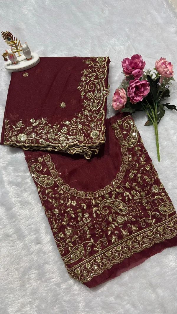 Exquisite_Maroon_Embroidered_Saree_Elevate_your_ethnic_look_with_this_stunning_maroon_saree_featuring_a_rich,_intricate_zari_border_and_delicate_floral_motifs._Crafted_from_premium_lightweight_fabric,_it_comes_with_a_heavily_embroidered_designer_blouse_piece_for_a_complete_royal_look._Perfect_for_weddings_and_festive_occasions.