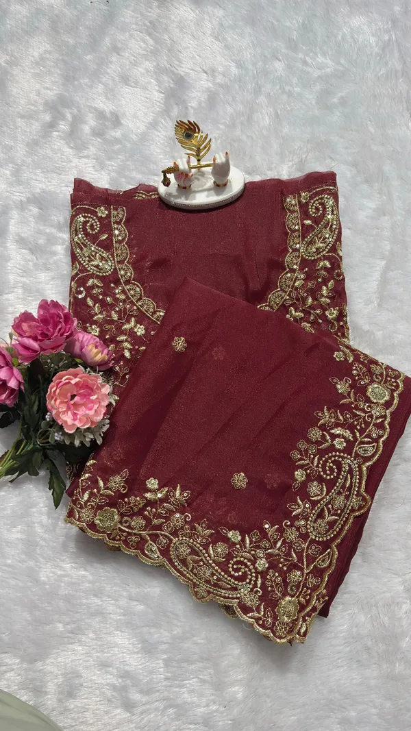Exquisite_Maroon_Embroidered_Saree_Elevate_your_ethnic_look_with_this_stunning_maroon_saree_featuring_a_rich,_intricate_zari_border_and_delicate_floral_motifs._Crafted_from_premium_lightweight_fabric,_it_comes_with_a_heavily_embroidered_designer_blouse_piece_for_a_complete_royal_look._Perfect_for_weddings_and_festive_occasions.