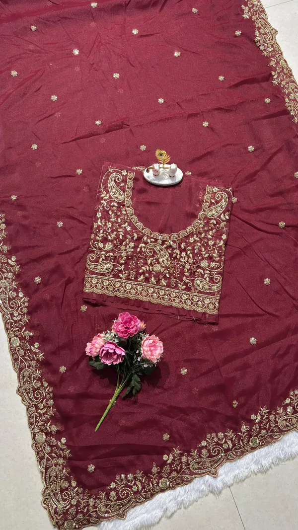 Exquisite_Maroon_Embroidered_Saree_Elevate_your_ethnic_look_with_this_stunning_maroon_saree_featuring_a_rich,_intricate_zari_border_and_delicate_floral_motifs._Crafted_from_premium_lightweight_fabric,_it_comes_with_a_heavily_embroidered_designer_blouse_piece_for_a_complete_royal_look._Perfect_for_weddings_and_festive_occasions.