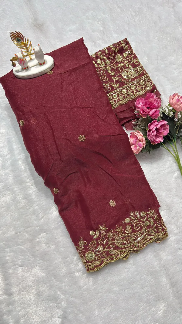 Exquisite_Maroon_Embroidered_Saree_Elevate_your_ethnic_look_with_this_stunning_maroon_saree_featuring_a_rich,_intricate_zari_border_and_delicate_floral_motifs._Crafted_from_premium_lightweight_fabric,_it_comes_with_a_heavily_embroidered_designer_blouse_piece_for_a_complete_royal_look._Perfect_for_weddings_and_festive_occasions.